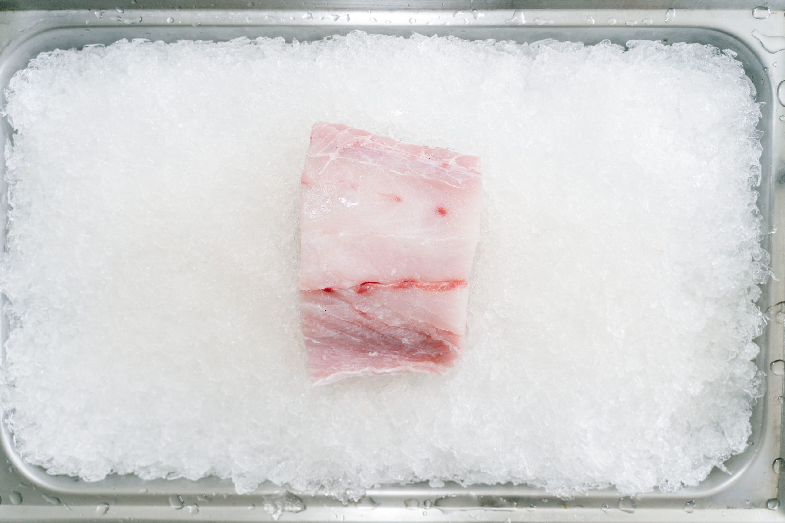 Fresh raw cod on crushed ice.